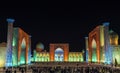 View of Registan square in Samarkand from Ulugbek madrassas, Sherdor madrassas and Tillya-Kari madrassas at night with multi-color