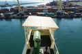 View on remote navigational console on the wing of ship bridge covered with Panama Canal shelter.