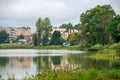 View of residential buildings and the embankment on Kirov Street across Lake Bologoe. City Bologoe Royalty Free Stock Photo