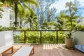 View from resort balcony or terrace on coconut palm trees and turquoise sea. Summer weekend in modern luxury hotel Royalty Free Stock Photo