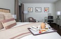 Resort hotel mansion bedroom suite bed, chairs, and desk Royalty Free Stock Photo