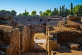 View of the restored arch entrance to the arena of the Roman Amphitheater of Merida illuminated by the light of dawn creating Royalty Free Stock Photo