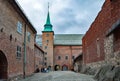 View of restored fortres buildings, fortifications built of large granite stones on a cloudy day