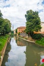 View of Retrone river and the clock tower of Vicenza, Italy Royalty Free Stock Photo