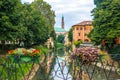 View of Retrone river and the clock tower of Vicenza, Italy Royalty Free Stock Photo