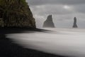 view of the Reynisfjara Black Sand beach with the landmark basalt columns and the Reynisdrangar sea stack Royalty Free Stock Photo