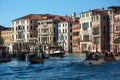 View from the Rialto Bridge with close up of facades of picturesque old buildings on the Grand Canal, gondolas and boats in Venice Royalty Free Stock Photo