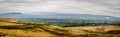 A view of an open valley from Pendle Hill on a winter`s day.