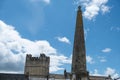 A view of Richmond Castle and the Obelisk in Richmond market place against a bright blue cloudy sky Royalty Free Stock Photo