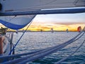 View through rigging to other yachts sailing at sunset Royalty Free Stock Photo