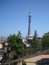 View of the Right Pavilion with a Pinnacle with a five-beam cross of the Park Guell in Barcelona, Spain
