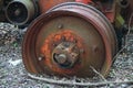 WHEEL RIM OF AN OLD RUSTED ABANDONED TRACTOR Royalty Free Stock Photo