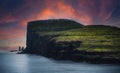 View at of Risin and Killingin the giant and the witch sea stacks on Streymoy island viewed from Tjornuvik at sunset