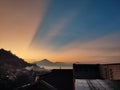 The view of the rising sun with fog beyond the mountains Royalty Free Stock Photo