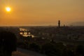 View of the River Arno and famous bridge Ponte Vecchio. Amazing evening golden hour light. Beautiful gold sunset in Florence. Royalty Free Stock Photo