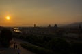 View of the River Arno and famous bridge Ponte Vecchio. Amazing evening golden hour light. Beautiful gold sunset in Florence. Royalty Free Stock Photo