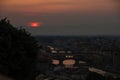 View of the River Arno and famous bridge Ponte Vecchio. Amazing evening golden hour light. Beautiful gold sunset in Florence. Royalty Free Stock Photo