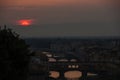 View of the River Arno and famous bridge Ponte Vecchio. Amazing evening golden hour light. Beautiful gold sunset in Florence. Royalty Free Stock Photo