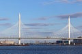 View from the river on the cable-stayed bridge over the Petrovsky fairway in the spring in St. Petersburg