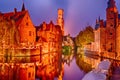 View of river canal and Belfort tower at twilight from Rozenhoedkaai,famous boat tour point in Bruges, Belgium Royalty Free Stock Photo