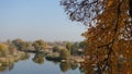 View of the river and the distant forest in autumn