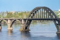 View of river Dnepr and railway ancient arched bridge.