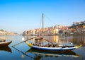 View of river Douro with the traditional wooden boat, Porto city in the background, Portugal Royalty Free Stock Photo