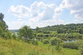 View of the river, forest and green meadows. White clouds in the Royalty Free Stock Photo