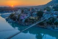 View of River Ganga and Lakshman Jhula bridge at sunset. Rishikesh. India