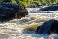 View of the river from the lower point waves and splashes of the river on the rapids a lot of stones Royalty Free Stock Photo
