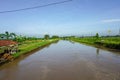 river water that flows between the highway and the fields Royalty Free Stock Photo