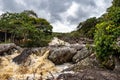 The river Mucugezinho in Chapada Diamantina, Bahia, Brazil with running water, forming a waterfall and Poco do Pato Royalty Free Stock Photo