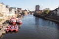 View of the River Ouse in York showing City Cruise boats and historic architecture