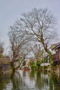 View of a river with a person sailing a boat Royalty Free Stock Photo