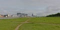 View on River Rine with Kranhaus buildings and cathedral from the green borders of Poller Wiesen park Royalty Free Stock Photo