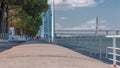 View from river Tagus waterfront of Lisbon's Nations park and Vasco da Gama Bridge timelapse, Portugal Royalty Free Stock Photo