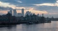 View of River Thames and City Skyline during dramatic sunrise. City of London