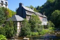 View on river with timber frame monument houses in center of medieval village