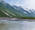 A view of a river tributary flowing down to Disenchartment Bay close to the Hubbard Glacier in Alaska Royalty Free Stock Photo