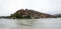 View of a river Tungabhadra and rocky hills and ruins of templ on shore Royalty Free Stock Photo