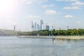 View of riverside of Moscow river and Moscow city skyscrapers behind the trees in the sunlight Royalty Free Stock Photo