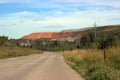 View of the road adjacent to the embankment near the Siberian town