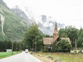 View of the road, church and mountains in Norway