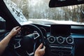 View of the road, drivers view. Man driving on a snowy mountain road Royalty Free Stock Photo