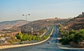 View from a road driving in the Amman city, with different elevation and a suburb in distance, Amman, Jordan