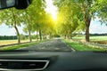 View of the road and forest through the windshield of the car Sunshine Royalty Free Stock Photo