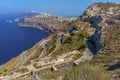 A view of the road leading down to the harbour at Athinios Port Santorini Royalty Free Stock Photo