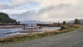 View from the road beside the log sort of rain clouds approaching. Royalty Free Stock Photo