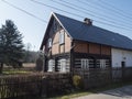 View from road on old rustic cottage half timbered house in small village Marenicky in luzicke hory, Lusatian Mountains Royalty Free Stock Photo