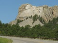 View from the road of the stone monuments of four US presidents at Mount Rushmore National Memorial in South Dakota Royalty Free Stock Photo